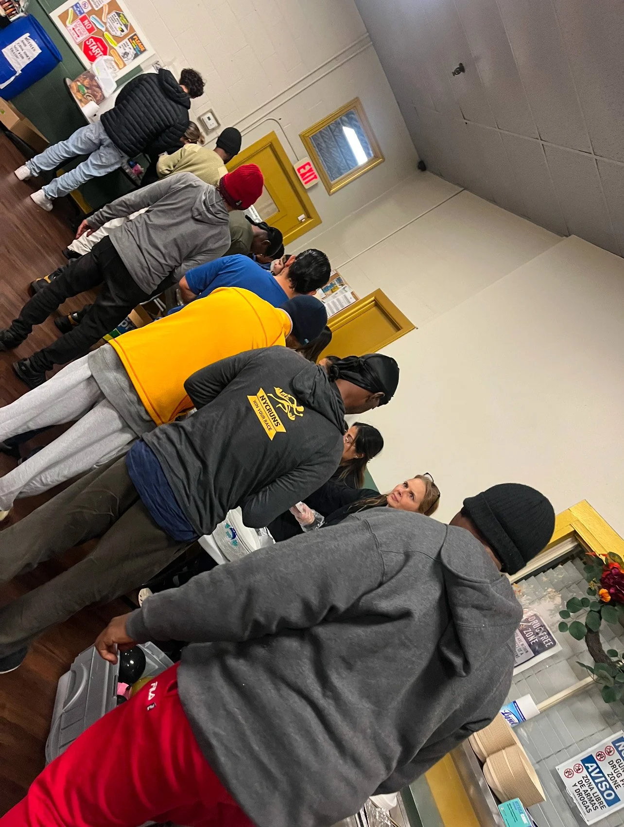 Guests resting on cots inside the warming center