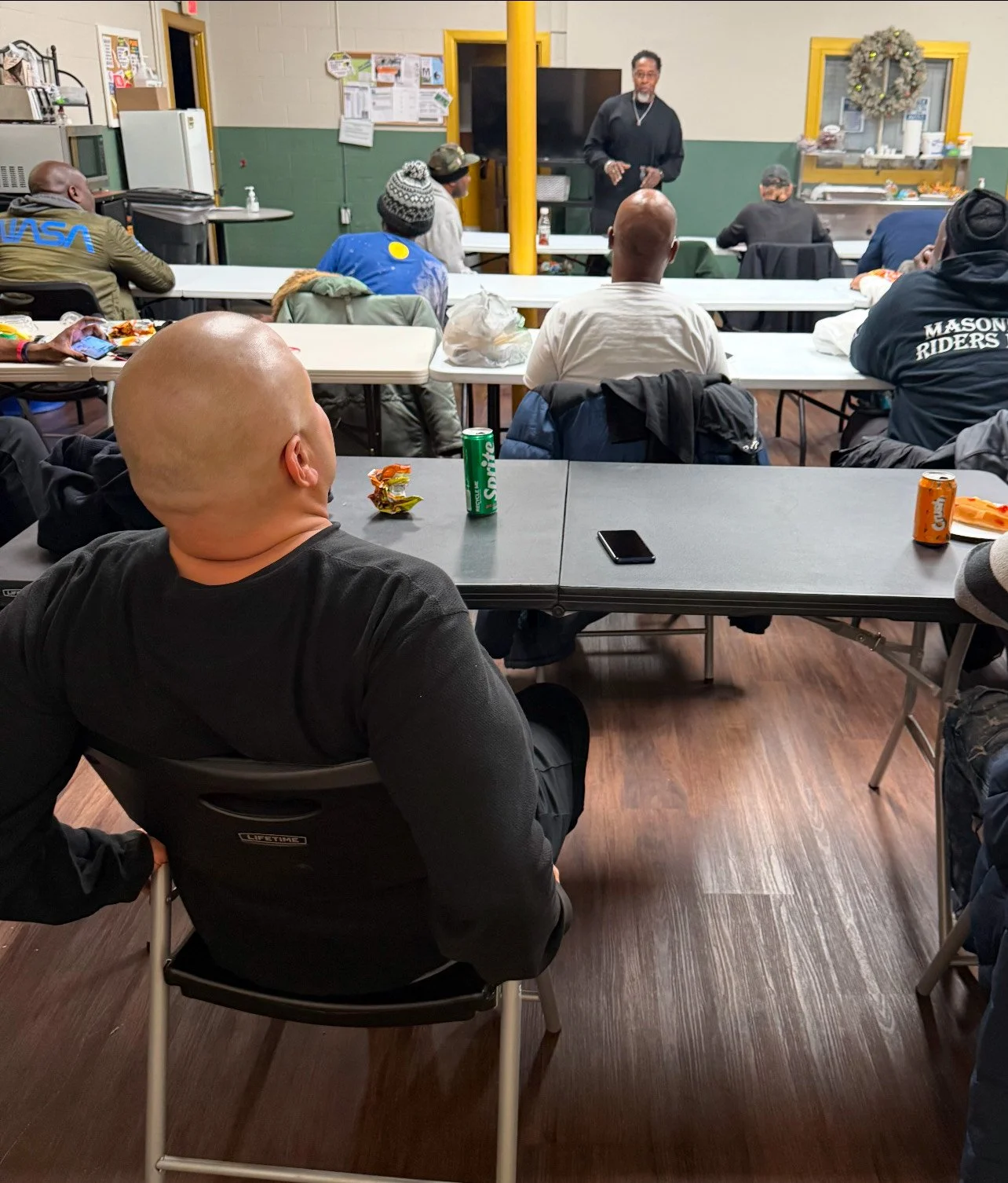 Guests seated around tables during a conflict management workshop