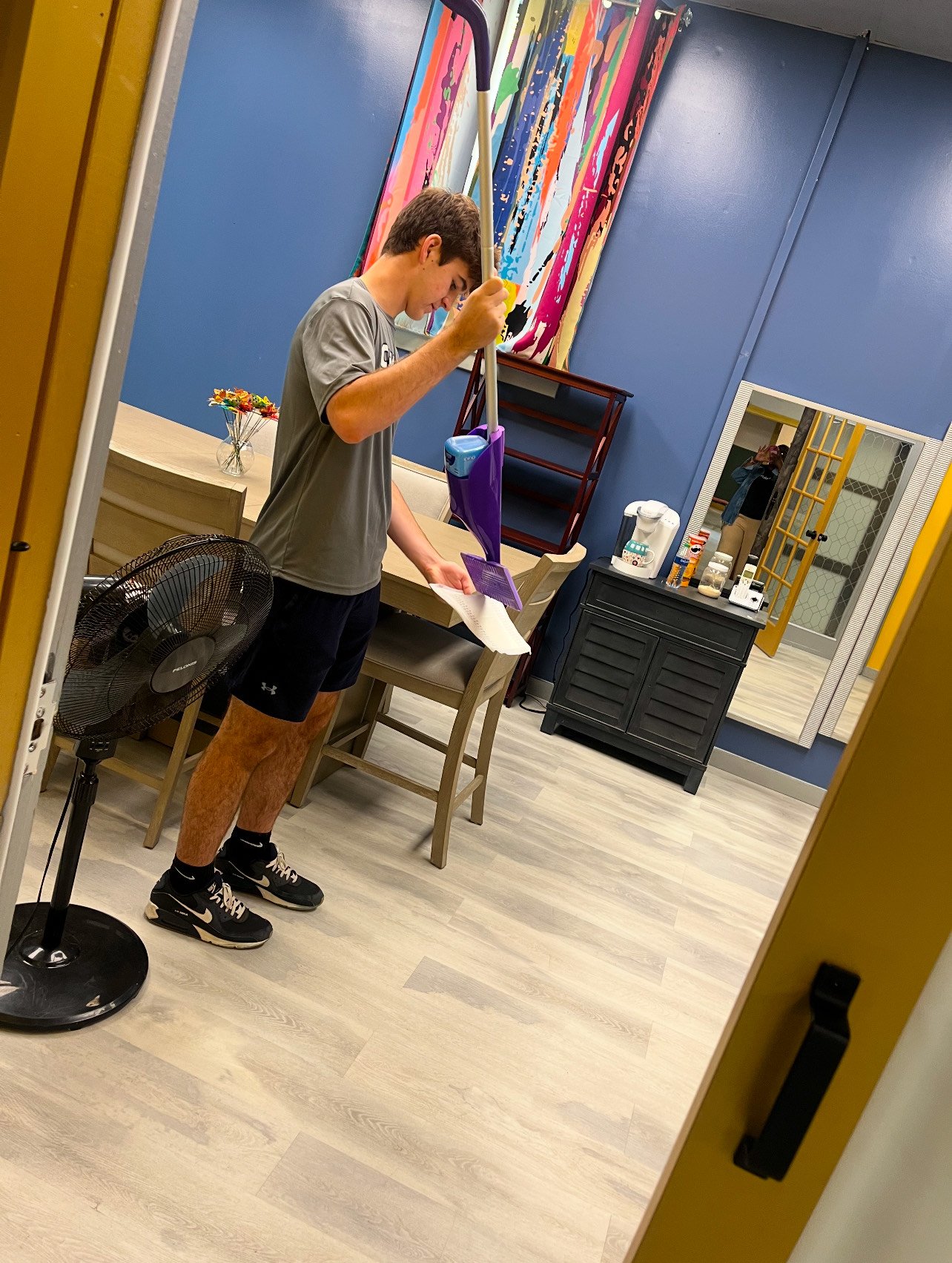 A volunteer sorting donated clothing at the shelter