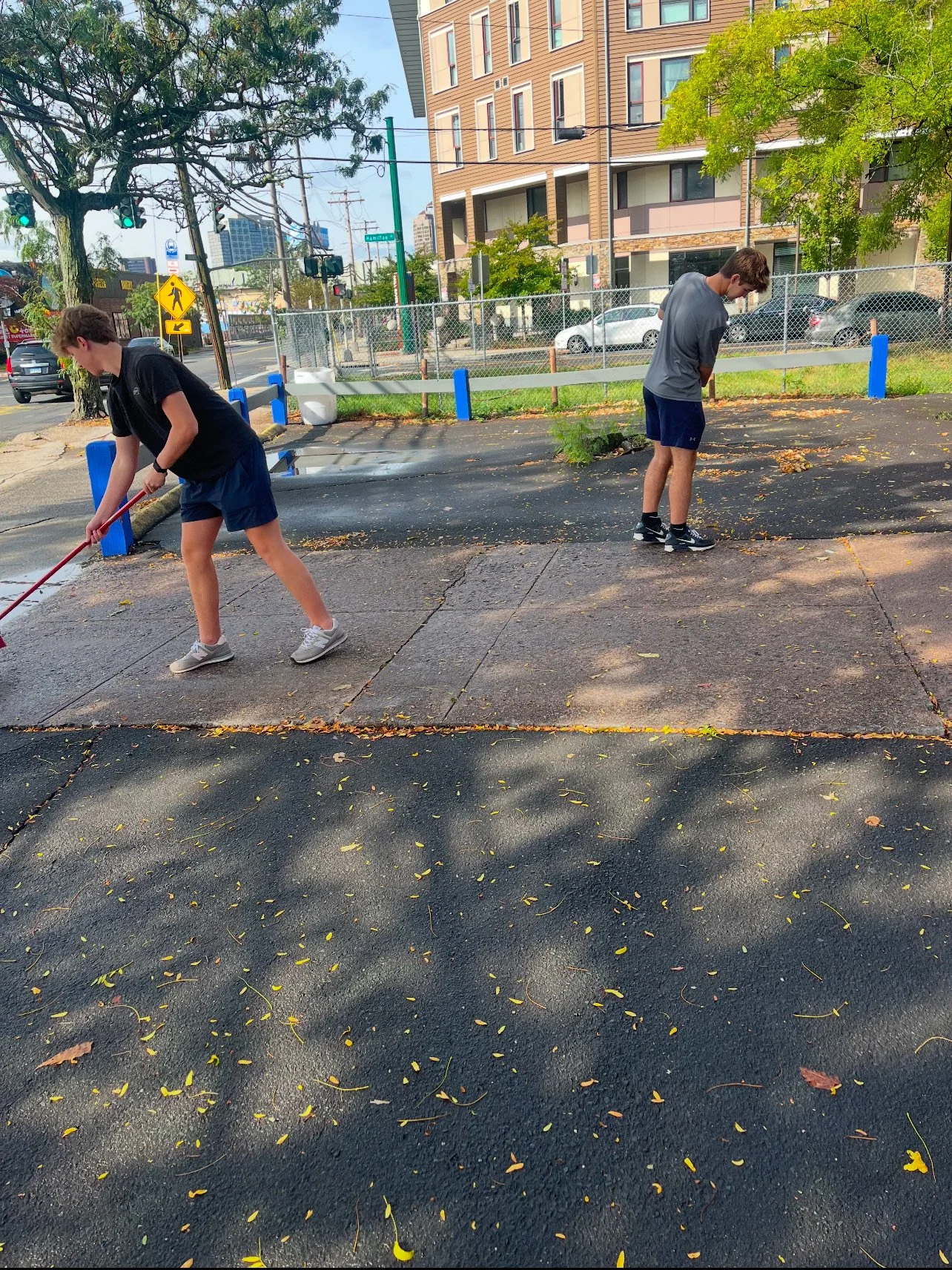 Volunteers cleaning up the lot outside the shelter building