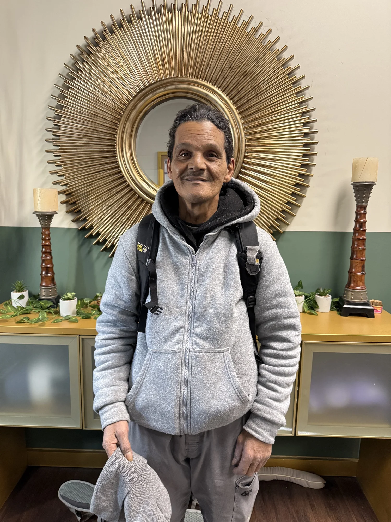 Richard "Lucky" Hernandez standing in the shelter common room